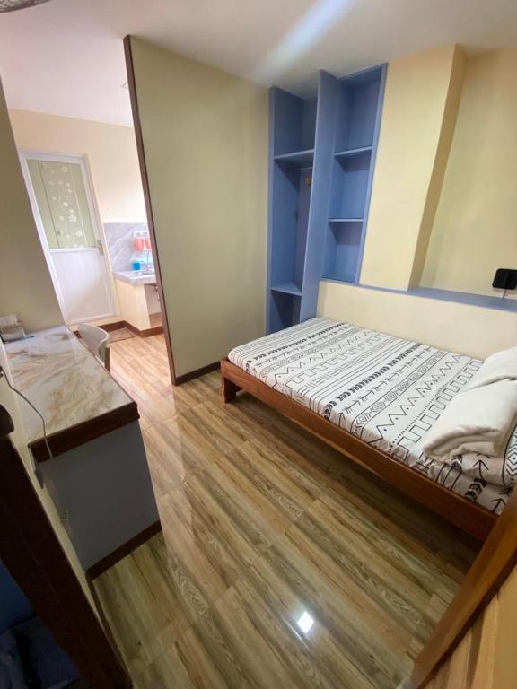 Postel nebo postele na pokoji v ubytování Calia’s Transient House