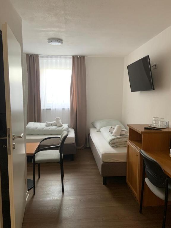 Postel nebo postele na pokoji v ubytování Pension Rexha am Weißensee