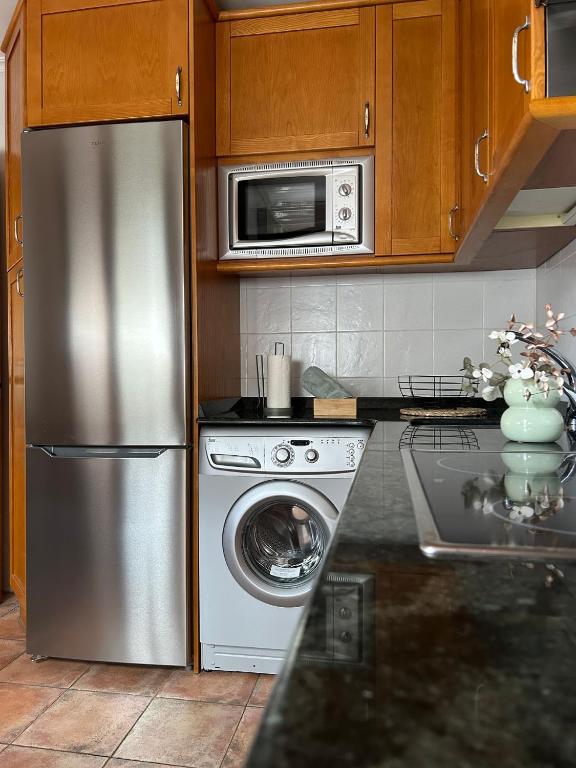 Kuchyň nebo kuchyňský kout v ubytování Apartamentos Remoña