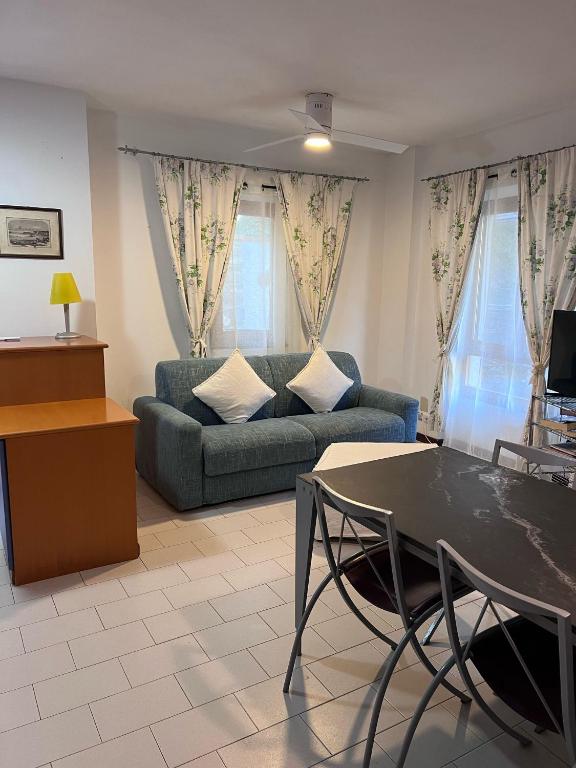 a living room with a couch and a table at Agriturismo Buranco in Monterosso al Mare