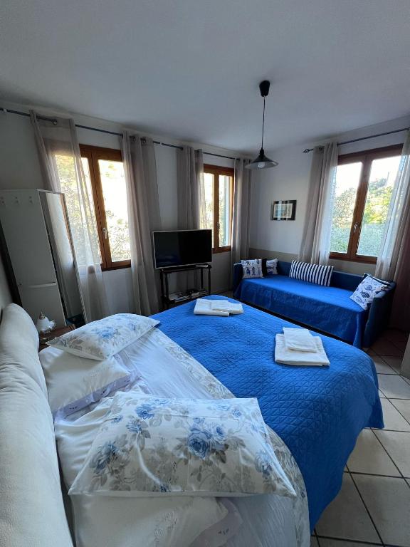 a living room with two beds and a couch at Agriturismo Buranco in Monterosso al Mare