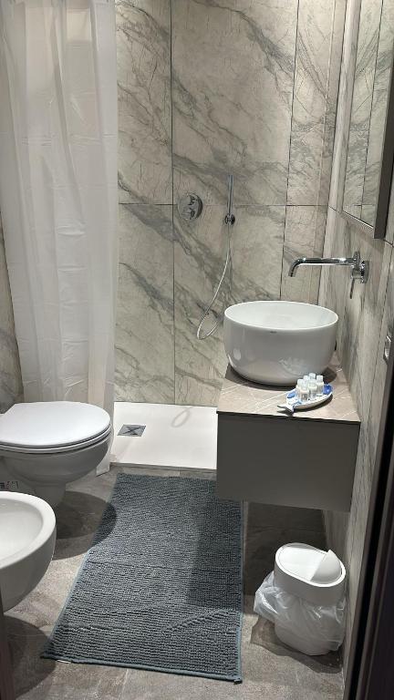 a bathroom with a sink and a toilet and a shower at Agriturismo Buranco in Monterosso al Mare