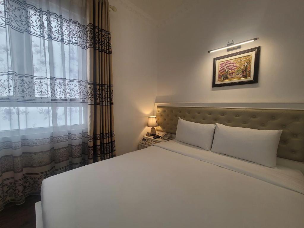 Postel nebo postele na pokoji v ubytování Luxor Boutique Hotel