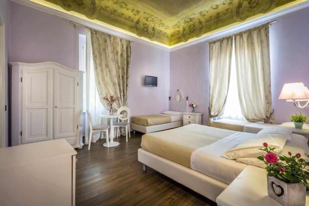 Postel nebo postele na pokoji v ubytování Hotel Ferrucci