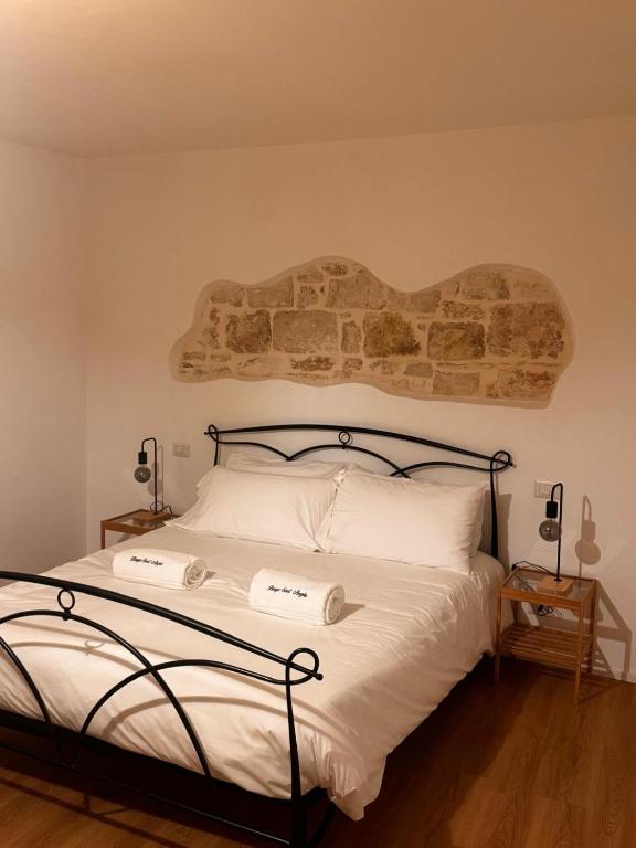Postel nebo postele na pokoji v ubytování Borgo Sant Angelo