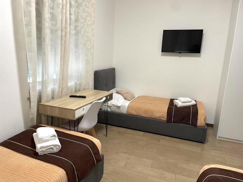 TV a/nebo společenská místnost v ubytování FIERA ROOMS