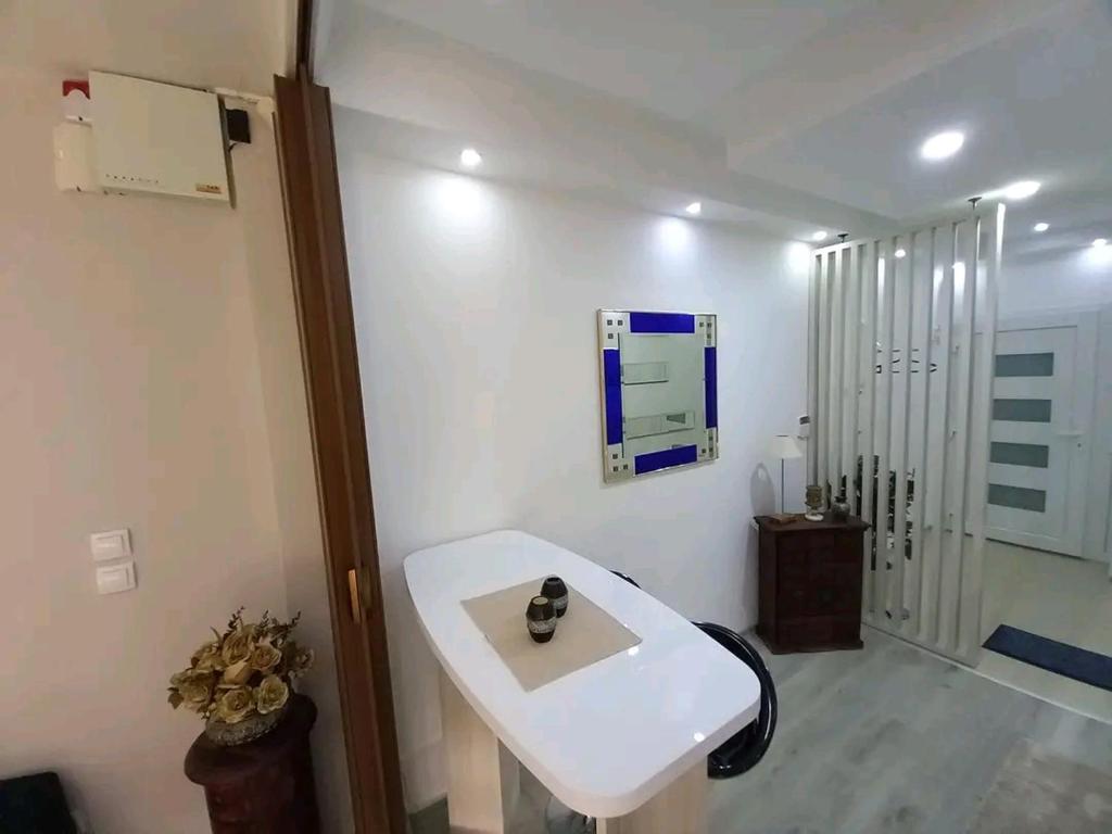 a bathroom with a white sink and a mirror at Sarajevo apartman Ilidza Springs parking free in Sarajevo