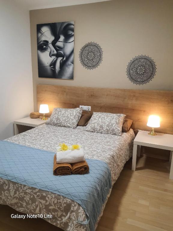 Posteľ alebo postele v izbe v ubytovaní Precioso apartamento a menos de 100m de la playa