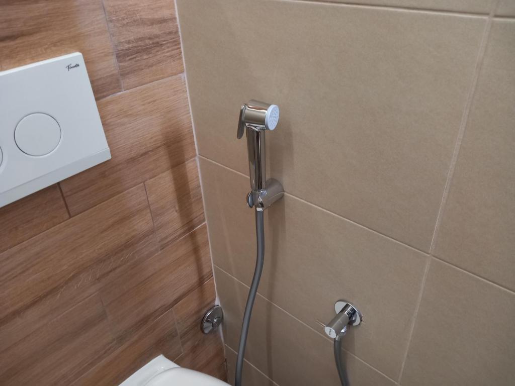 a bathroom with a toilet and a shower at Sarajevo apartman Ilidza Springs parking free in Sarajevo