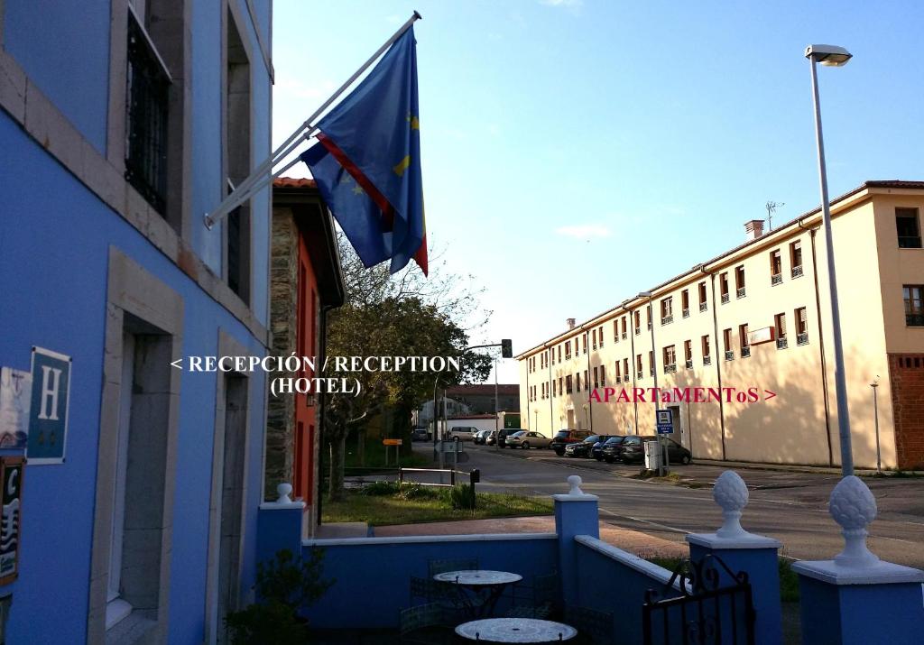 a flag flying on the side of a building at Selgas de Cudillero in Cudillero