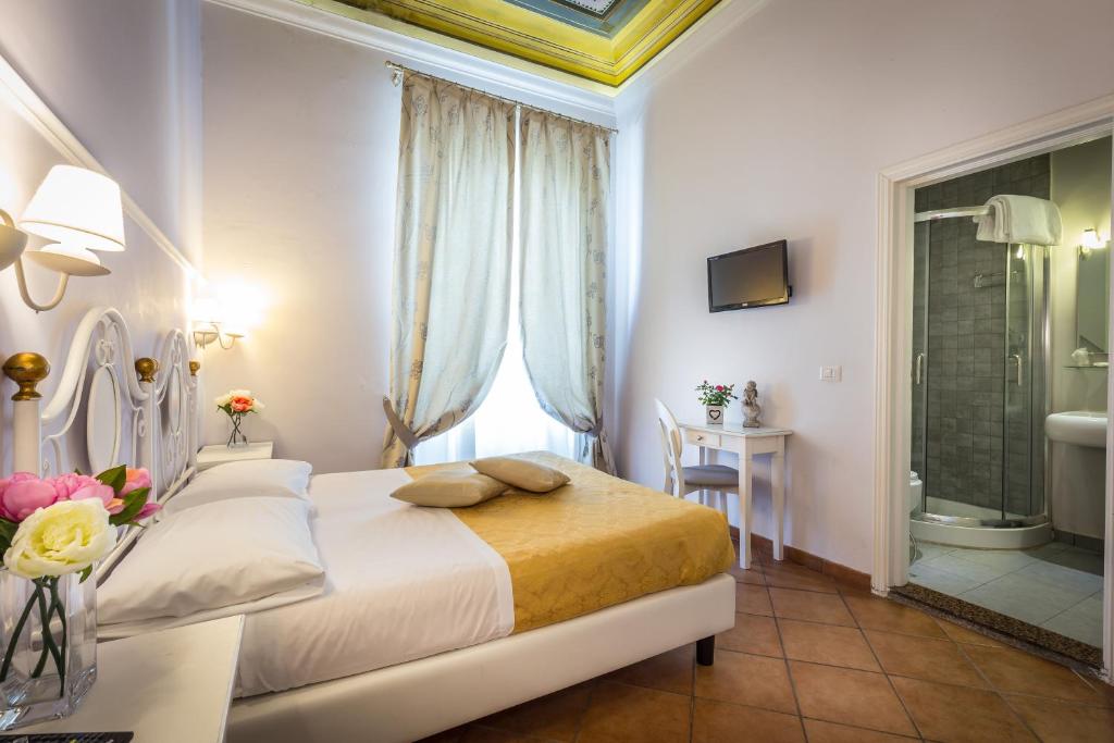 Postel nebo postele na pokoji v ubytování Hotel Ferrucci