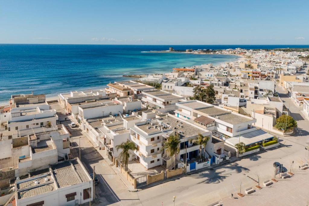 an aerial view of a town next to the ocean at B&B Gioiello del Mare in Torre Lapillo
