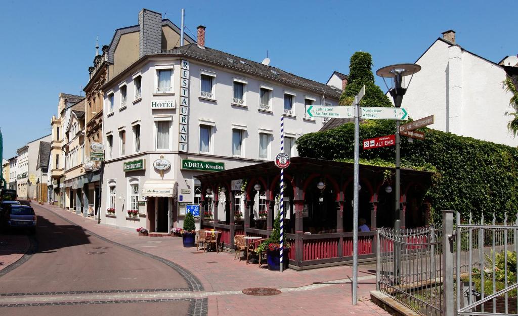 a street with a building on the side of the road at Hotel Restaurant Adria Kroatien in Bad Ems