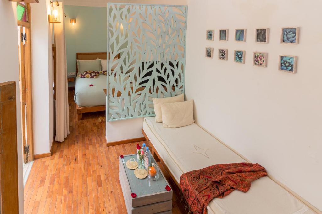 Postel nebo postele na pokoji v ubytování Dar Korsan