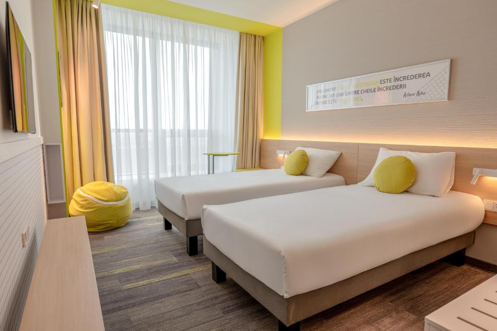 Postel nebo postele na pokoji v ubytování ibis Styles Chisinau