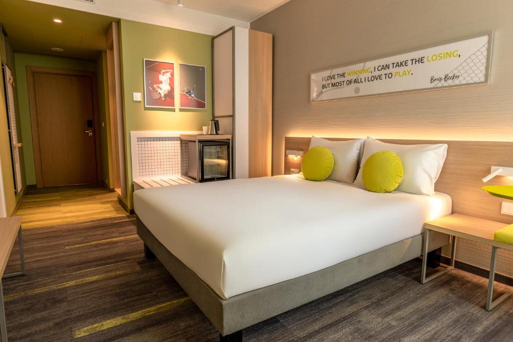Postel nebo postele na pokoji v ubytování ibis Styles Chisinau