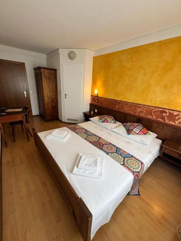 Postel nebo postele na pokoji v ubytování Hotel Post Cunter Biancardi