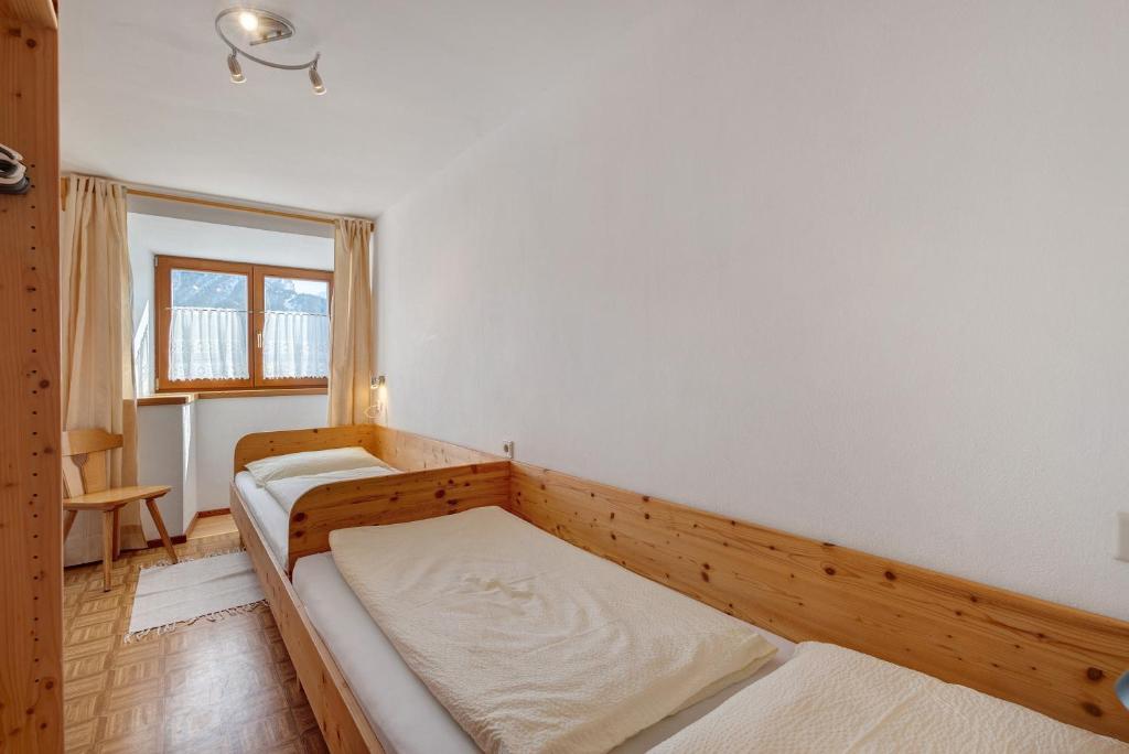 Postel nebo postele na pokoji v ubytování Wegscheiderhof