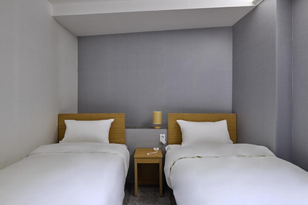Postel nebo postele na pokoji v ubytování D Stay Hostel Dongdaemun