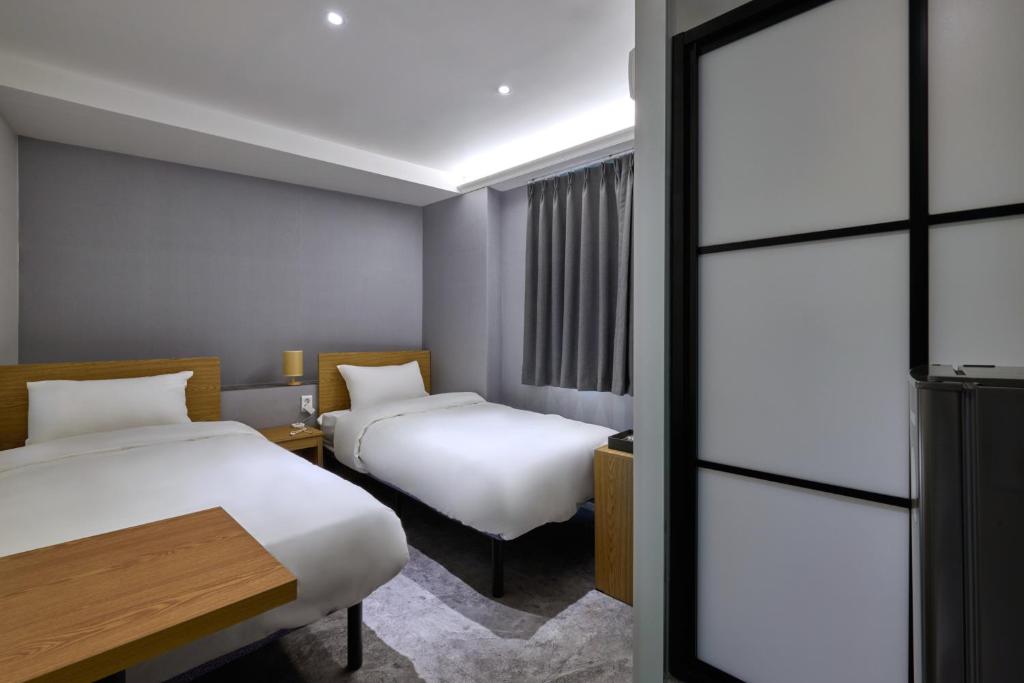 Postel nebo postele na pokoji v ubytování D Stay Hostel Dongdaemun