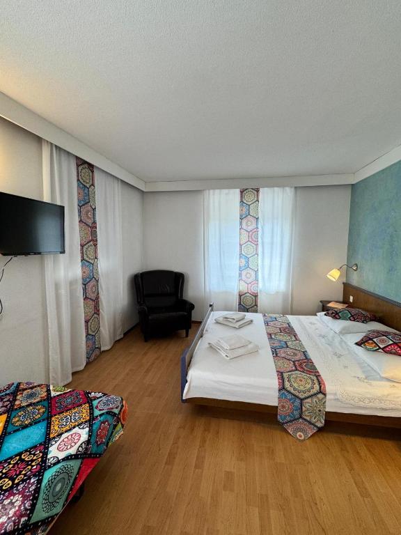 Postel nebo postele na pokoji v ubytování Hotel Post Cunter Biancardi