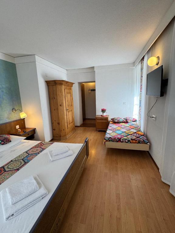 Postel nebo postele na pokoji v ubytování Hotel Post Cunter Biancardi