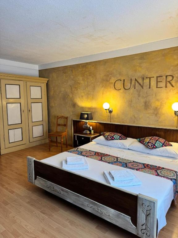 Postel nebo postele na pokoji v ubytování Hotel Post Cunter Biancardi