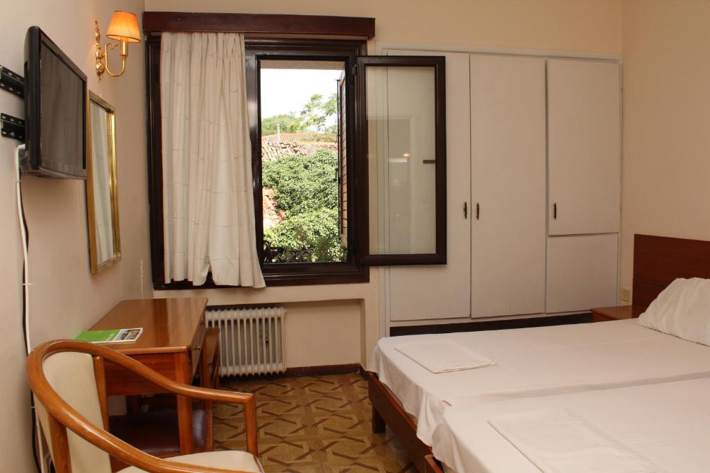Postel nebo postele na pokoji v ubytování Nefeli Hotel