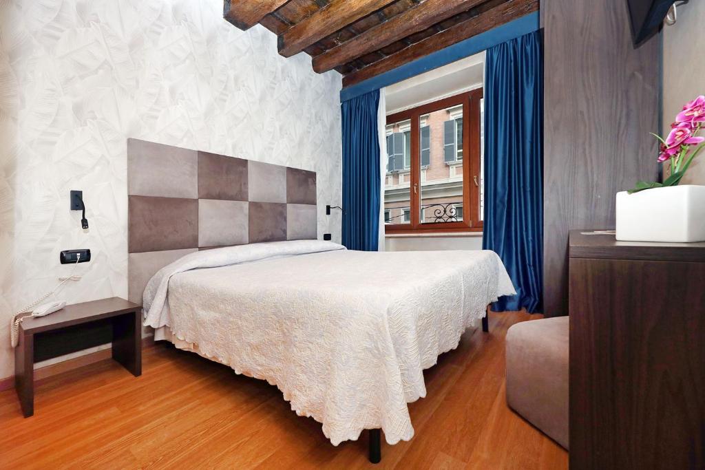 Postel nebo postele na pokoji v ubytování Hotel Rimini