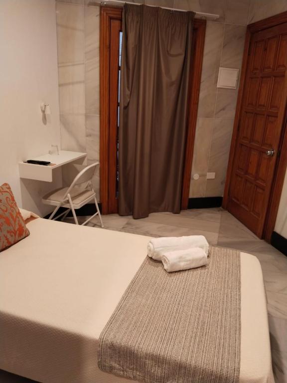 Postel nebo postele na pokoji v ubytování Hotel Océano Centro