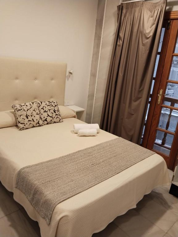Postel nebo postele na pokoji v ubytování Hotel Océano Centro