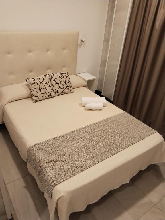 Postel nebo postele na pokoji v ubytování Hotel Océano Centro