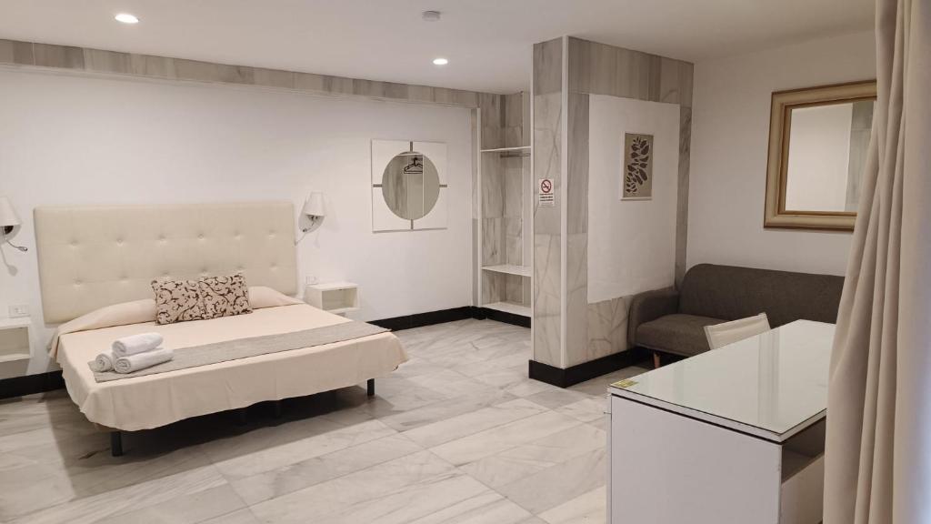 Postel nebo postele na pokoji v ubytování Hotel Océano Centro
