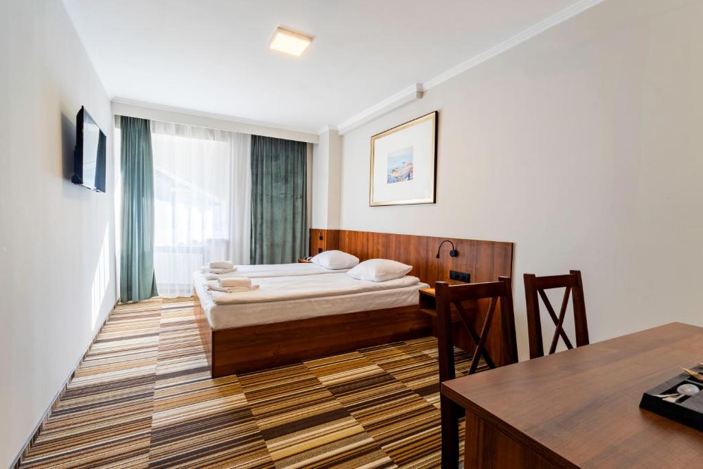 Posteľ alebo postele v izbe v ubytovaní Hit Apartments