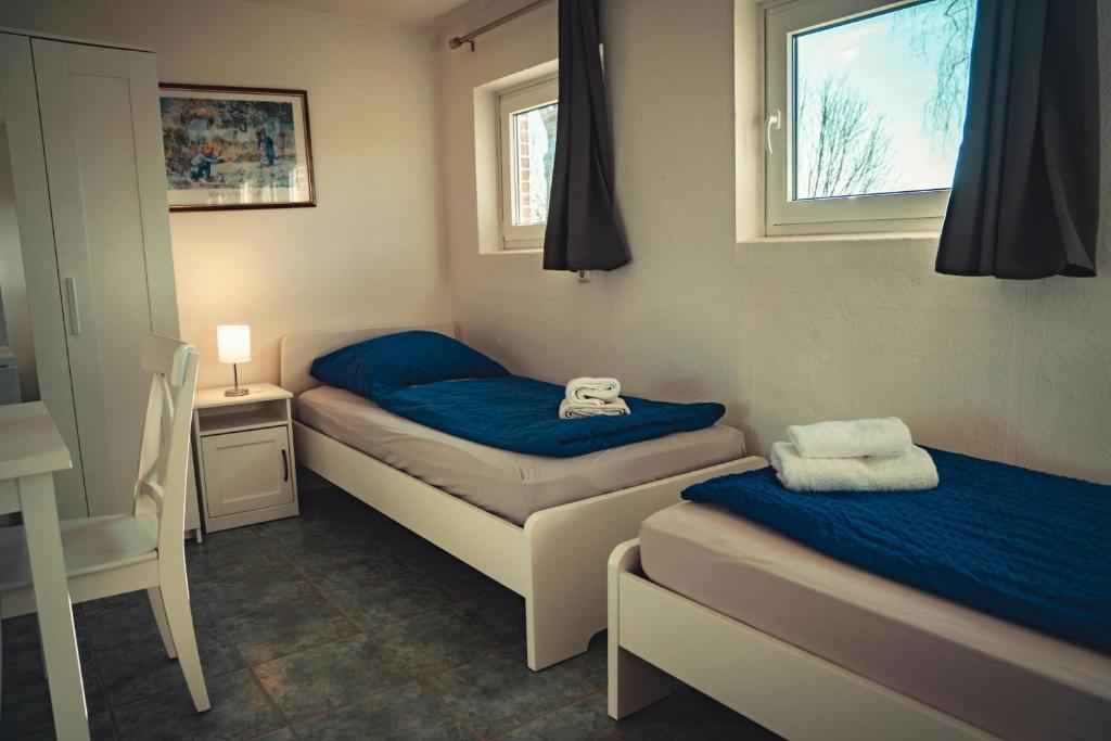 Postel nebo postele na pokoji v ubytování Ottos Ferienhäuser