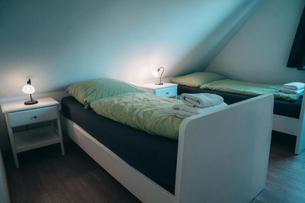 Postel nebo postele na pokoji v ubytování Ottos Ferienhäuser