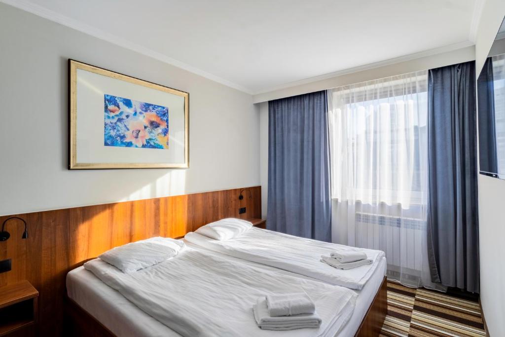 Posteľ alebo postele v izbe v ubytovaní Hit Apartments