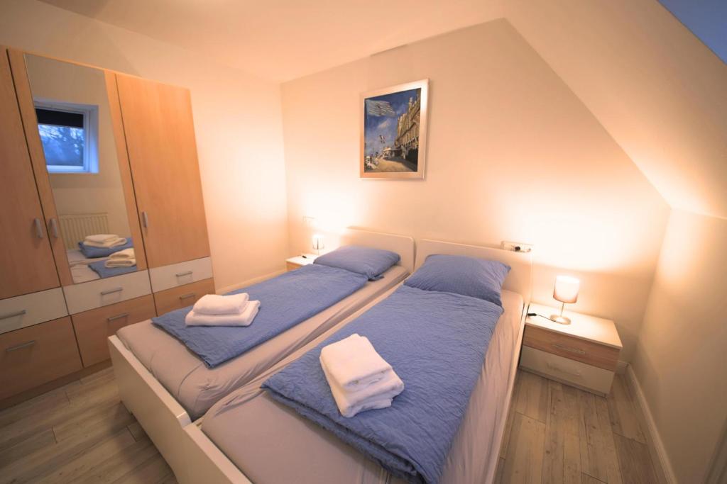Postel nebo postele na pokoji v ubytování Appartementhaus Schleiblick
