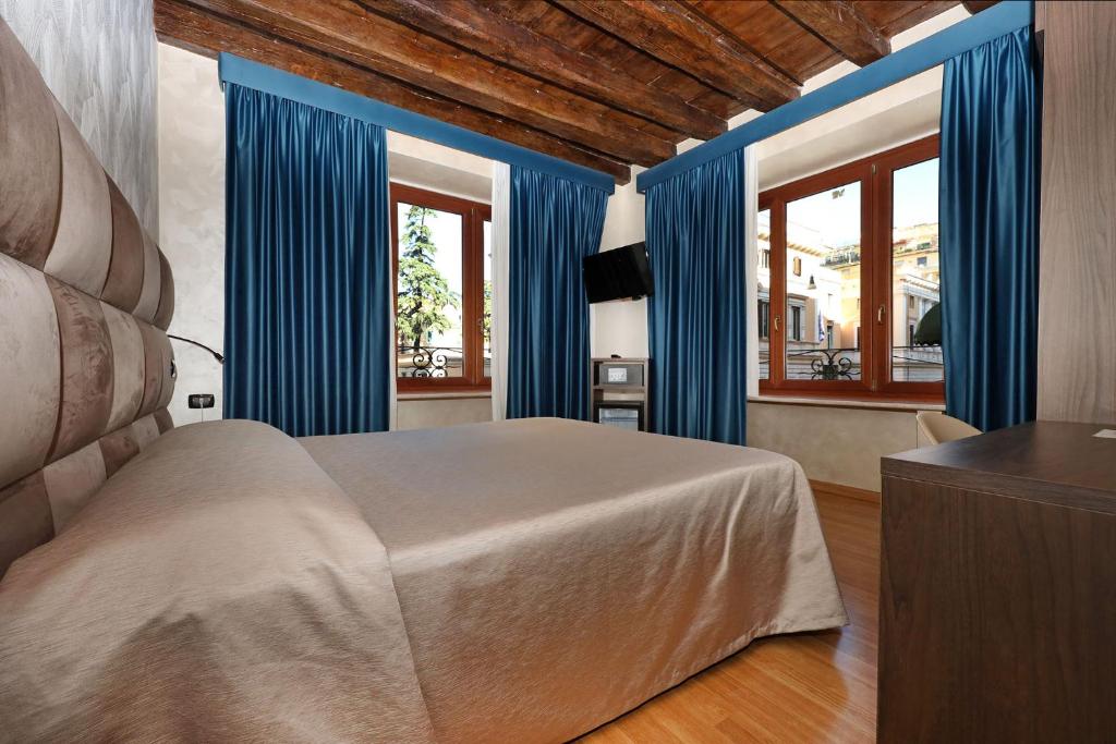 Postel nebo postele na pokoji v ubytování Hotel Rimini