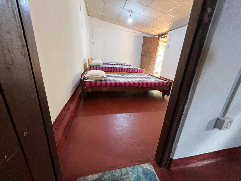 Postel nebo postele na pokoji v ubytování Gleeful Hostel