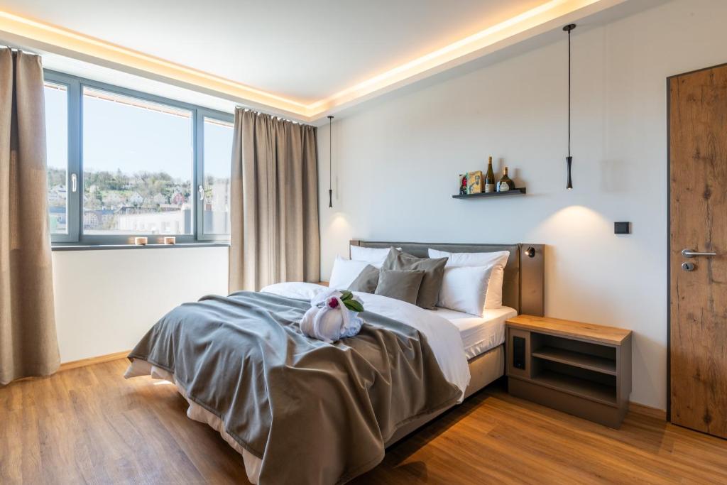 Postel nebo postele na pokoji v ubytování Hotel MEINTZ