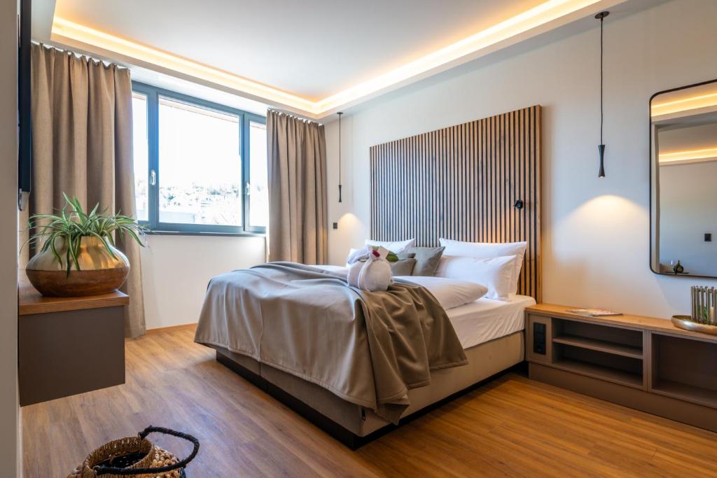 Postel nebo postele na pokoji v ubytování Hotel MEINTZ