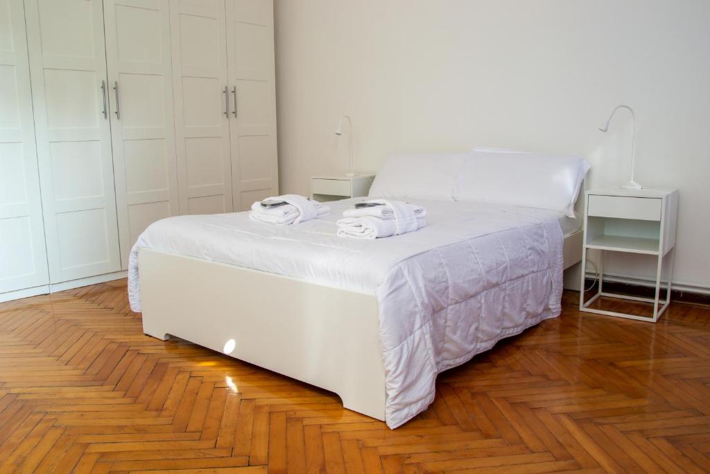 Łóżko lub łóżka w pokoju w obiekcie Padova Umberto center appartments