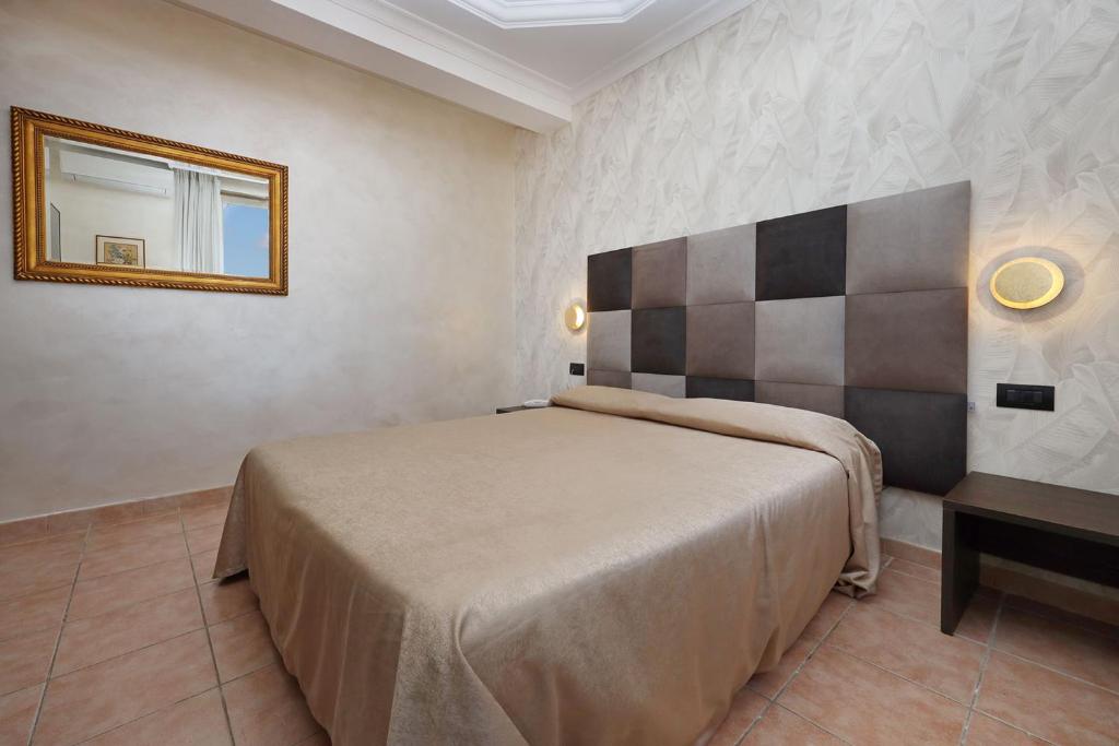Postel nebo postele na pokoji v ubytování Hotel Rimini