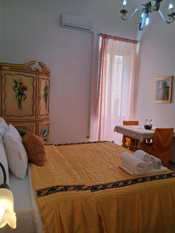 Postel nebo postele na pokoji v ubytování BnB '900 Lecce centro