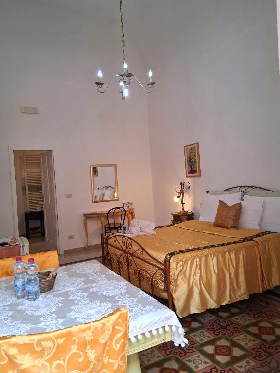 Postel nebo postele na pokoji v ubytování BnB '900 Lecce centro