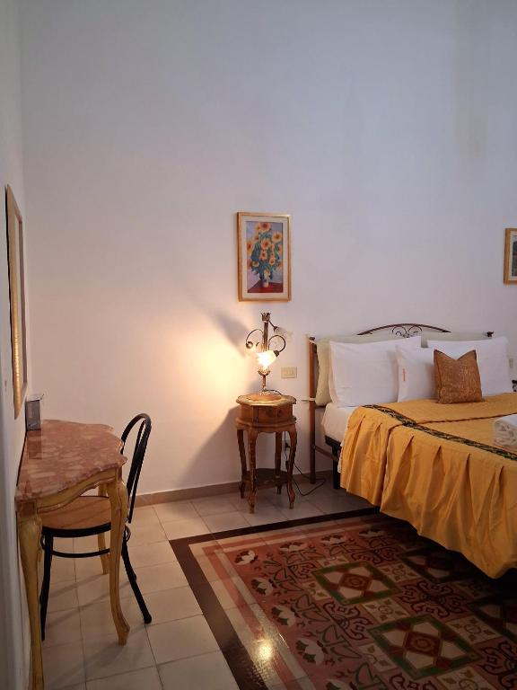 Postel nebo postele na pokoji v ubytování BnB '900 Lecce centro