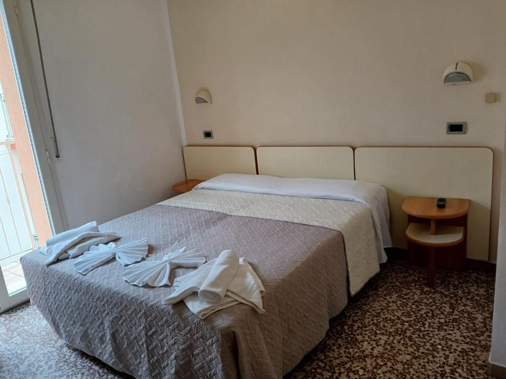 Postel nebo postele na pokoji v ubytování Hotel Golino