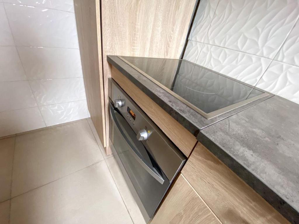 Η κουζίνα ή μικρή κουζίνα στο Pôlinéo Résidence