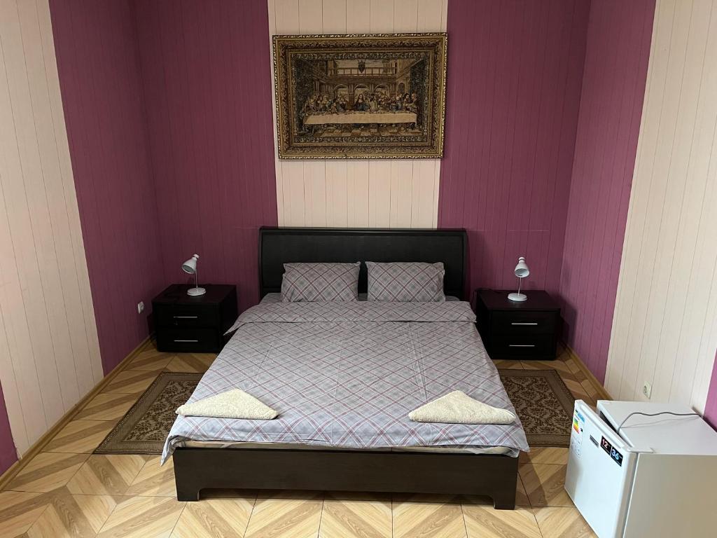 Postel nebo postele na pokoji v ubytování Mini Hotel Leon
